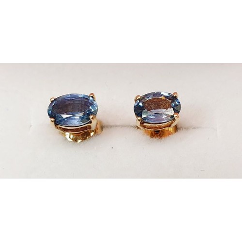 38 - A pair of yellow metal earrings set with sapphire. UK shipping £14.