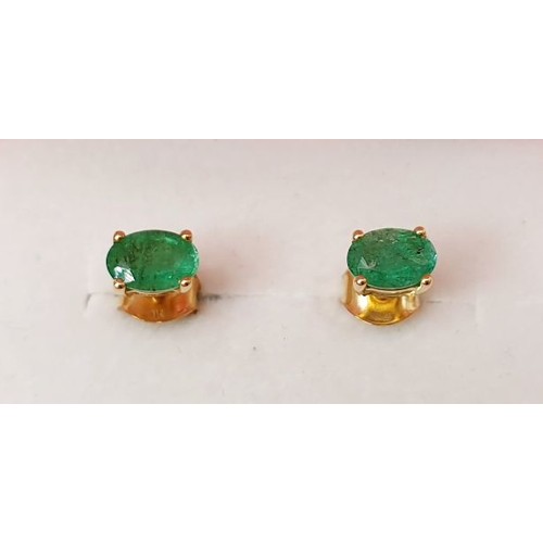 40 - A pair of 9ct gold earrings set with emerald. UK shipping £14.