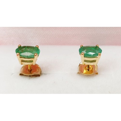 40 - A pair of 9ct gold earrings set with emerald. UK shipping £14.