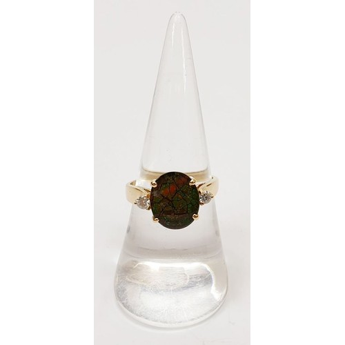 31 - A hallmarked 14ct gold ring set with ammolite and diamond, size N/O, gross weight 3.7g. UK shipping ... 