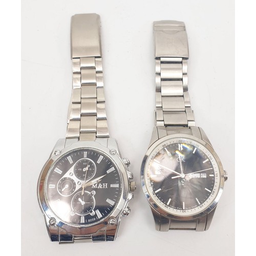 64 - A gentleman's Calvin Klein quartz wrist watch, together with one other quartz wristwatch. UK shippin... 