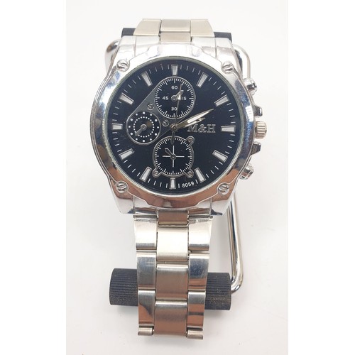 64 - A gentleman's Calvin Klein quartz wrist watch, together with one other quartz wristwatch. UK shippin... 