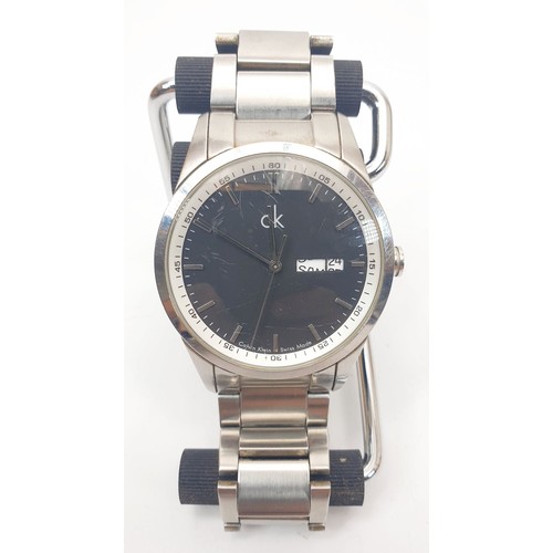 64 - A gentleman's Calvin Klein quartz wrist watch, together with one other quartz wristwatch. UK shippin... 