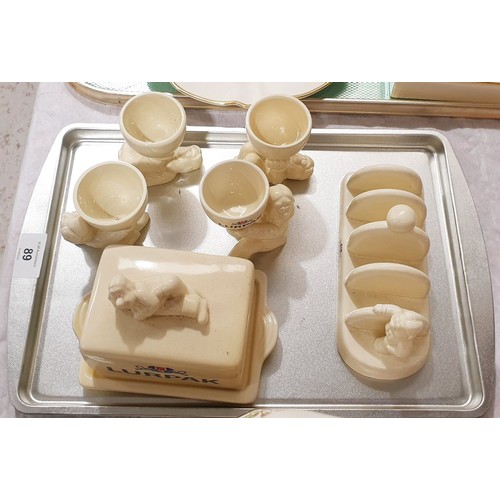 89 - A Lurpak toast rack, butter dish and four egg cups. No shipping. Arrange collection or your own pack... 