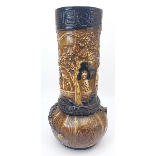 299 - An antique Bretby vase decorated in relief with lizards and Japanese scenes, height 13.25