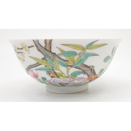 302 - A Chinese porcelain bowl finely hand painted with relief prunus and flowers, diameter 5.75