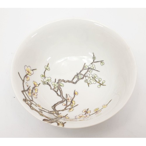 302 - A Chinese porcelain bowl finely hand painted with relief prunus and flowers, diameter 5.75