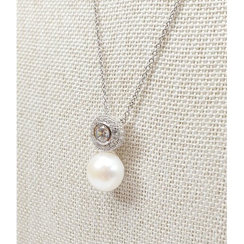 6 - A silver pendant and earrings set with pearls and white stones. UK shipping £14.