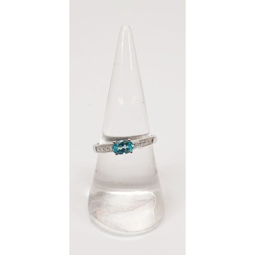 10 - A hallmarked 9ct white gold ring set with a teal coloured stone and diamonds, size O/P, gross weight... 