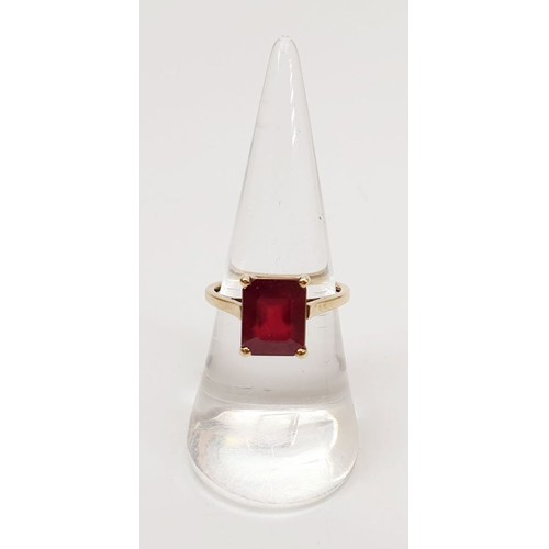 12 - A hallmarked 9ct gold ring set with treated ruby, size N/O, gross weight 2.7g. UK shipping £14.