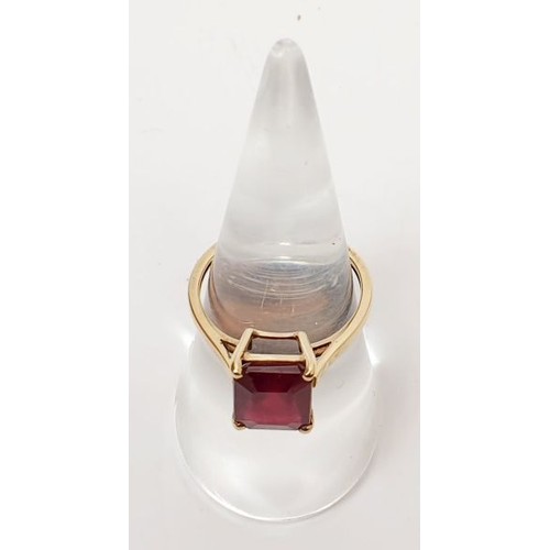 12 - A hallmarked 9ct gold ring set with treated ruby, size N/O, gross weight 2.7g. UK shipping £14.