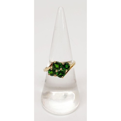 13 - A hallmarked 9ct gold tsavorite cluster ring, size O/P, gross weight 2.4g. UK shipping £14.