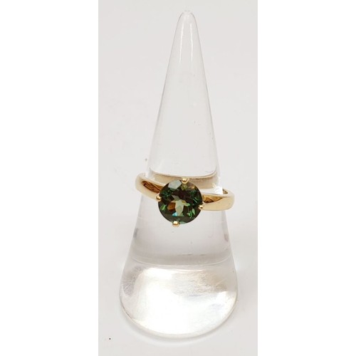 14 - A hallmarked 9ct gold ring set with tourmaline, size N, gross weight 3.4g. UK shipping £14.