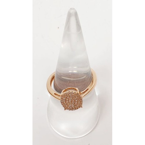 19 - A hallmarked 9ct rose gold diamond cluster ring totalling .25 carat, size Q, gross weight 2.1g. UK s... 