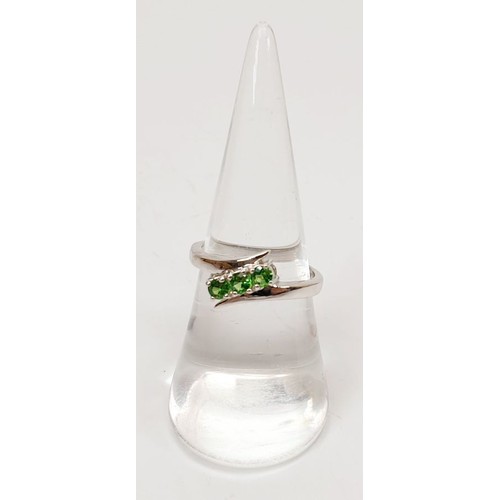 23 - A hallmarked 9ct white gold ring set with tsavorite, size N, gross weight  2.9g. UK shipping £14.