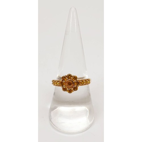 26 - A hallmarked 9ct gold demantoid garnet cluster ring, size Q, gross weight 2g. UK shipping £14.