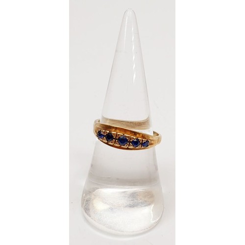 36 - A hallmarked 9ct gold ring set with sapphires, size N/O, gross weight 3.1g. UK shipping £14.