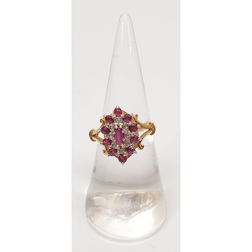 37 - A hallmarked 9ct gold ruby and diamond cluster ring, size M, gross weight 3.1g. UK shipping £14.