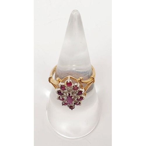 37 - A hallmarked 9ct gold ruby and diamond cluster ring, size M, gross weight 3.1g. UK shipping £14.