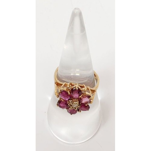 38 - A hallmarked 9ct gold ruby and diamond cluster ring, size M, gross weight 3.2g. UK shipping £14.