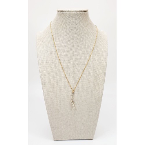 45 - A 9ct gold pendant set with white stones on a 9ct gold chain, gross weight 1.3g. UK shipping £14.