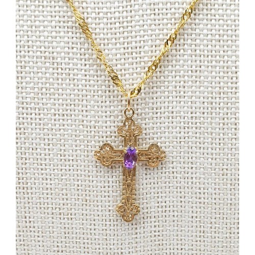 46 - A yellow metal pierce work cross set with an amethyst on a 9ct gold chain, gross weight 2.3g. UK shi... 