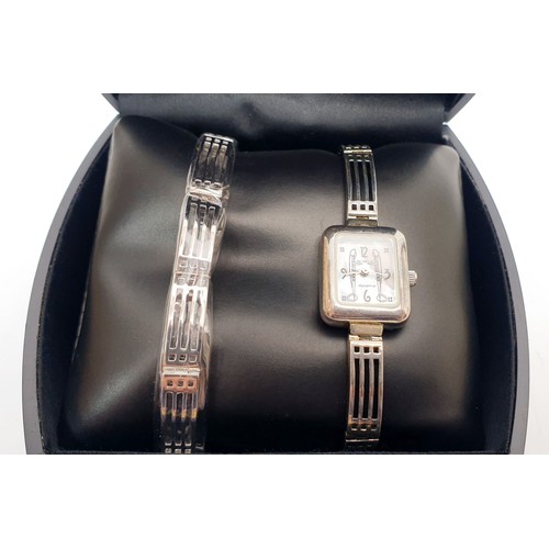 70 - The Art of Mackintosh ladies silver quartz wrist watch, working order together with a matching silve... 