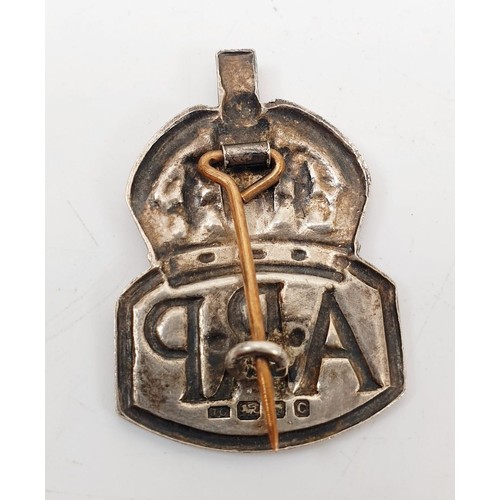 77 - A hallmarked silver ARP badge, London 1938, a World War II defence medal, an active service 1914-15 ... 