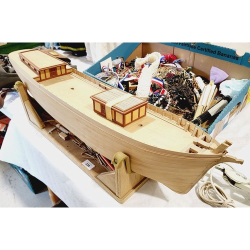 338 - A part built wooden model boat, length 34