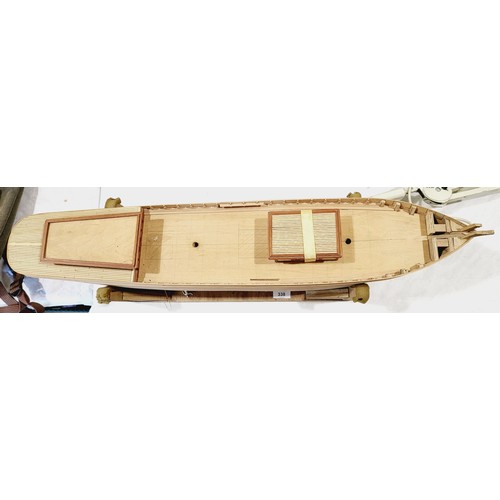 338 - A part built wooden model boat, length 34