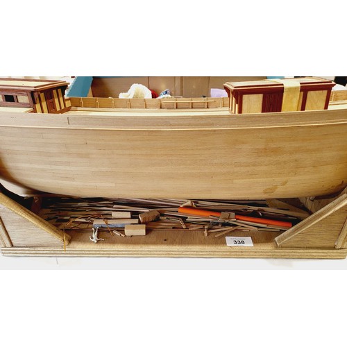 338 - A part built wooden model boat, length 34