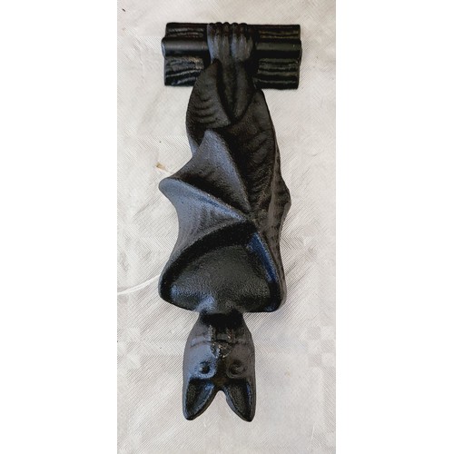 321 - A cast iron bat door knocker, length 7