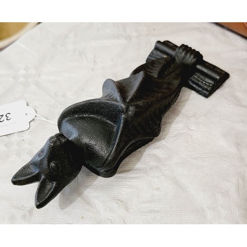 321 - A cast iron bat door knocker, length 7