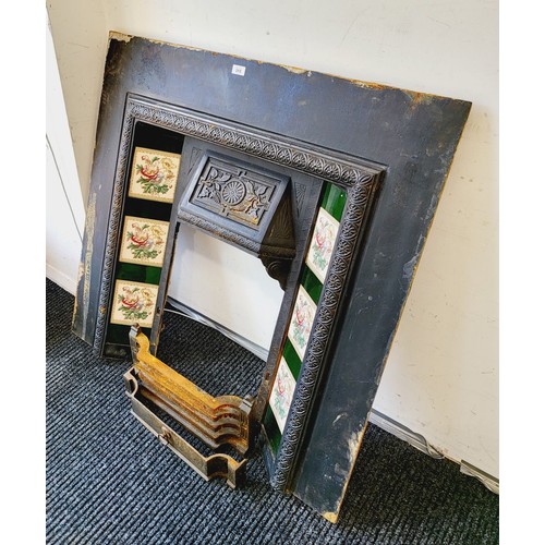 313 - An early 20th century cast iron and tile fire surround, height 40.25