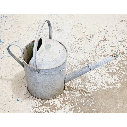 309 - A vintage galvanised watering can. No shipping. Arrange collection or your own packer and shipper, p... 