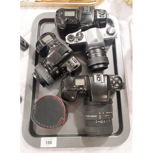 186 - A Nikon F-601 camera, a Minolta Dynax 500SI, and Pentax Asahi camera and a Minolta Dynax 700 SI came... 