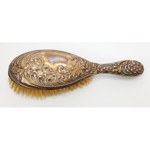 5 - A hallmarked silver backed dressing table brush, Chester 1905. UK shipping £14.