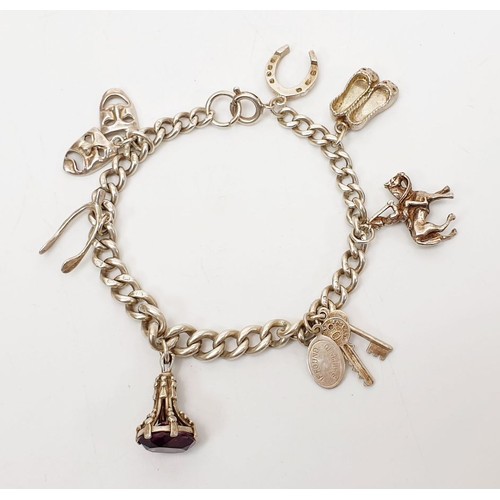 10 - A silver charm bracelet, gross weight 29g. UK shipping £14.