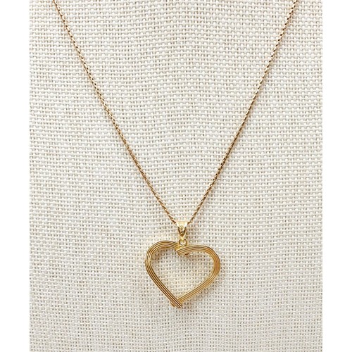 13 - A 9ct gold heart shaped pendant on a 9ct gold chain, weight 3g. UK shipping £14.