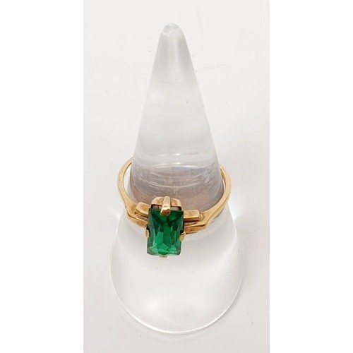 8 - A 9ct gold ring set with a green stone, size N, gross weight 2.3g. UK shipping £14.