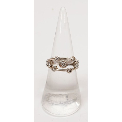 11 - A hallmarked 18ct white gold diamond set bubble ring, size M, gross weight 5.5g. UK shipping £14.