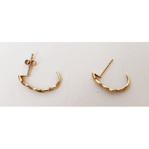 19 - A pair of 9ct gold earrings set with diamonds, gross weight 1.4g. UK shipping £14.