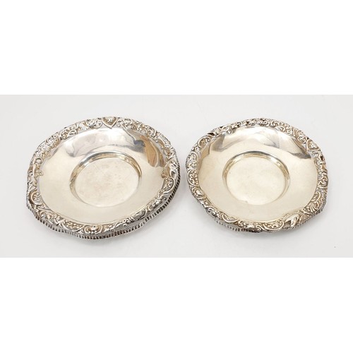 38 - A pair of hallmarked silver dishes with pierce work rims, A/F, diameter 4.25