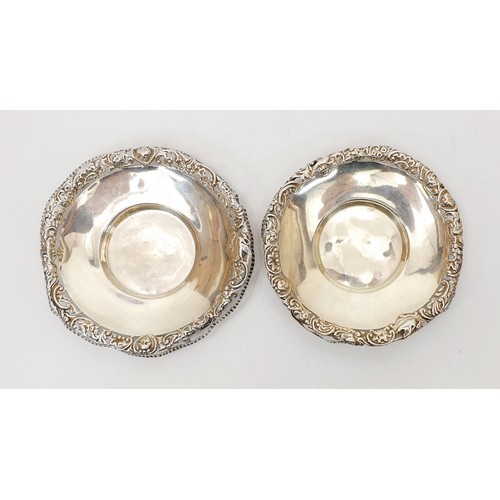 38 - A pair of hallmarked silver dishes with pierce work rims, A/F, diameter 4.25