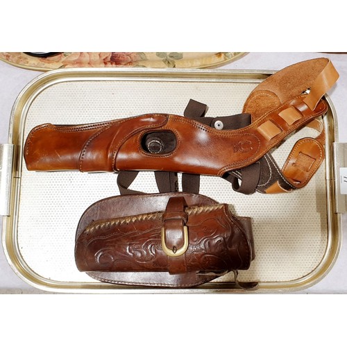 77 - A vintage tooled leather holster together with a leather shoulder holster. UK shipping £14.