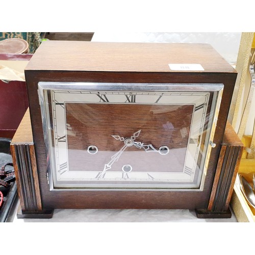 88 - An Art Deco oak cased mantel clock, height 8.5