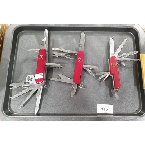 115 - Three Swiss Army knives including a Victorinox which is A/F. UK shipping £14.