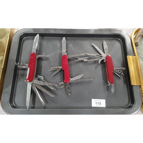 115 - Three Swiss Army knives including a Victorinox which is A/F. UK shipping £14.