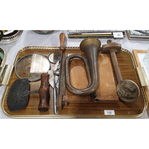 118 - A tray of assorted including an antique wooden food press and a brass bugle, diameter 3.5