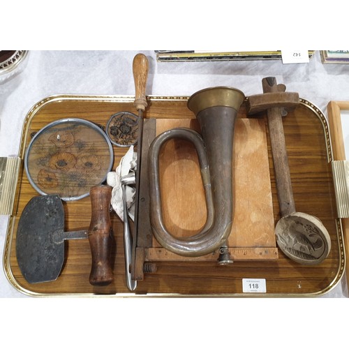 118 - A tray of assorted including an antique wooden food press and a brass bugle, diameter 3.5